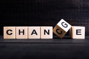 Wooden cube flip with word "change" to "chance" on wood table. Take a chance on yourself in group therapy or individual counseling at Northside counseling center in Indianapolis, IN