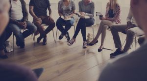 People sitting in a circle for group counseling with a mental health therapist in Indianapolis, IN