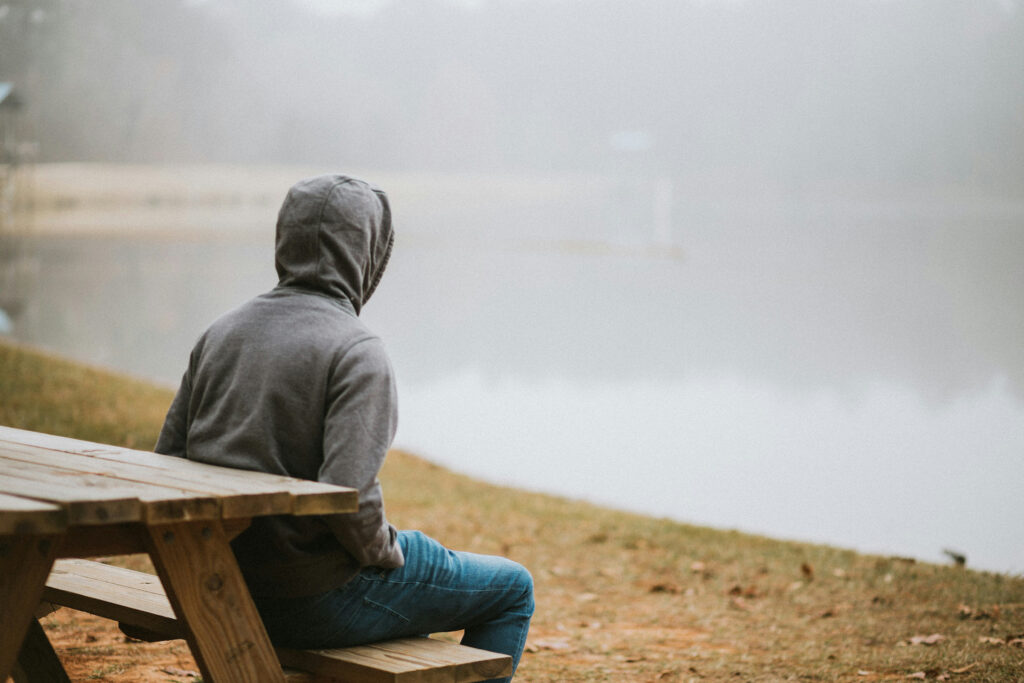Person overlooking a foggy landscape