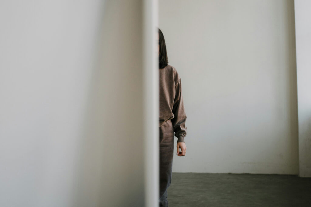 Person looking in partially in a mirror