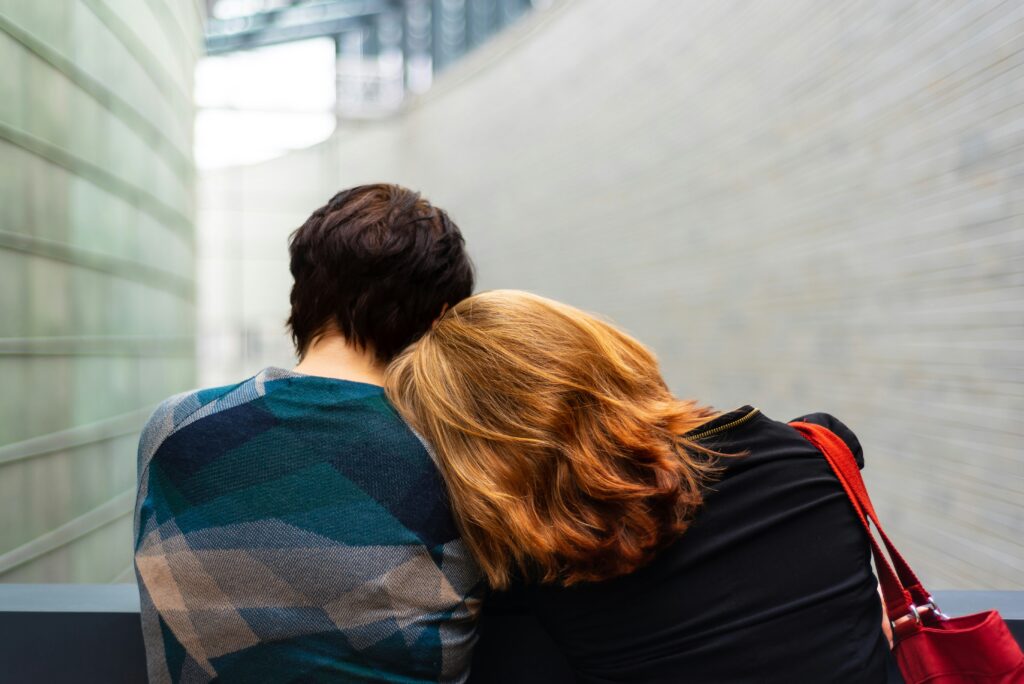 A person leaning on someone's shoulder